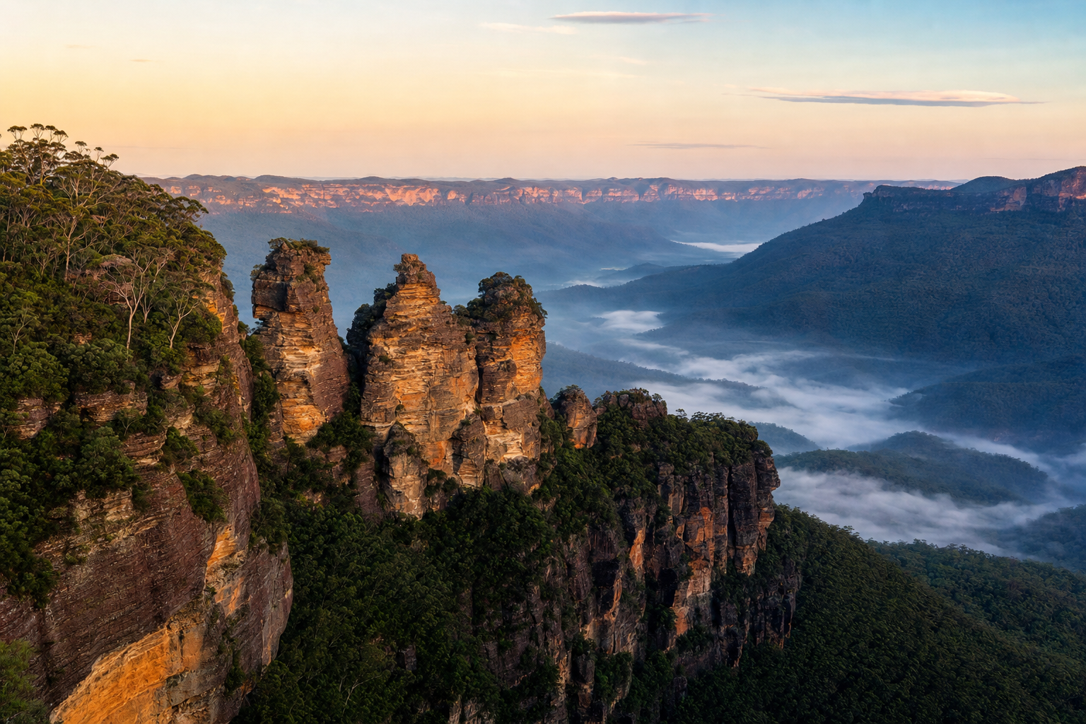 Three Sisters rock formation at Echo Point in the Blue Mountains with morning mist below in the eucalyptus valley